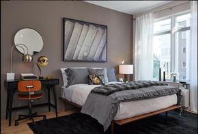 Harrison apartment for rent - A bedroom with a bed, desk, and chair.