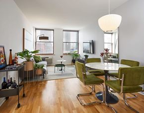 Jersey City apartment for rent - a living room with white walls and hardwood floors
