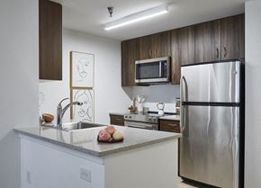 Hoboken apartment for rent - a kitchen with a sink and a refrigerator