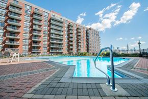 Hoboken apartment for rent - an outdoor swimming pool with an apartment building in the background