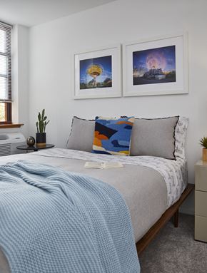 Hoboken apartment for rent - a bedroom with a bed and two pictures on the wall