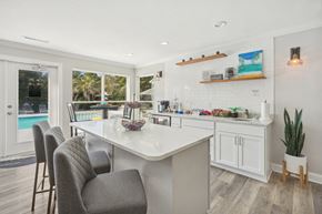 Wilmington apartment for rent - A kitchen with a white countertop and a chair.