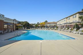 New Bern apartment for rent - A large swimming pool with a blue bottom and a sign that says "GET OUT OF THE WATER".