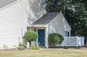 Waldorf apartment for rent - apartment building exterior showing patio surrounded by a white fence