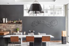 Denver apartment for rent - A modern dining room with a large table and chairs.