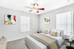 Bradenton apartment for rent - Furnished bedroom with bed and nightstand.