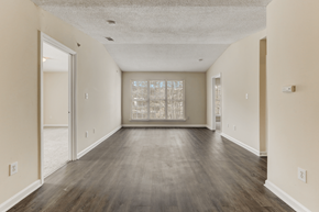 Durham apartment for rent - the spacious living room of an empty house with a large window