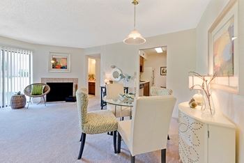 A living room with a fireplace and a chair.