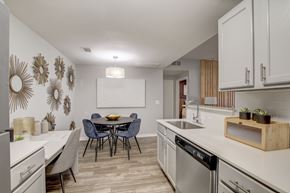 Kyle apartment for rent - A modern kitchen with a dining table and chairs.