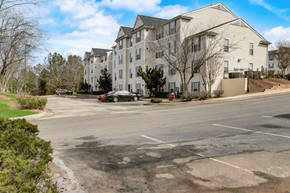 Durham apartment for rent - an empty parking lot in front of an apartment building