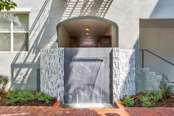 Gaming courtyard with fire pit and water feature
