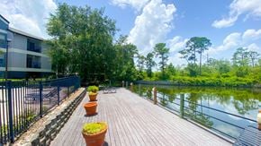 Orlando apartment for rent - Sundeck with lounge seating overlooking lake surrounded by native landscaping