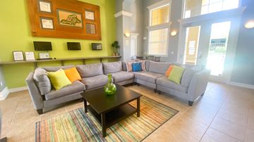 Windemere apartment for rent - A living room with a grey couch and a coffee table.