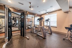 Knoxville apartment for rent - A gym with a variety of equipment including treadmills, weights, and exercise machines.