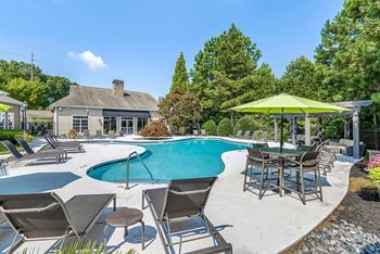 Outdoor and covered swimming pools with sundeck seating and pergola