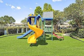 Bradenton apartment for rent - Playground with a yellow and blue slide.