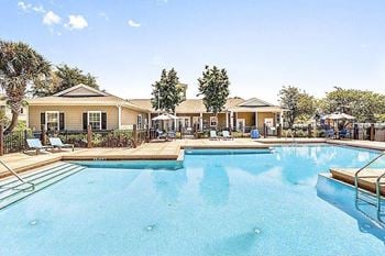 Waterfront resort-style pool with sundeck