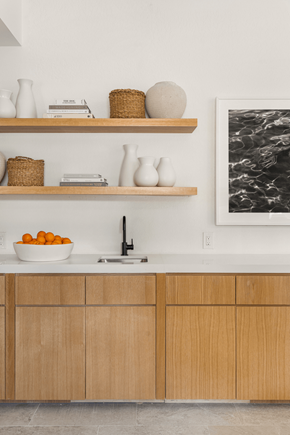 Coconut Creek apartment for rent - a kitchen with white countertops and wooden cabinets