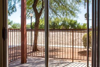 Metal railing next to tree