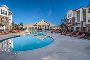 Concord apartment for rent - A large swimming pool in front of apartment buildings.