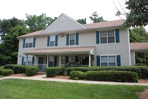 Huntersville apartment for rent - Building Exterior surrounded by shrubbery and trees
