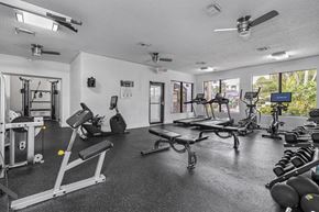 Boca Raton apartment for rent - A spacious gym with a variety of equipment including weights and cardio machines.