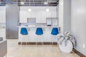 Murray apartment for rent - clubhouse kitchen with white cabinets and blue chairs