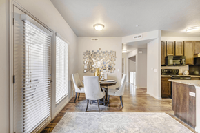 Murray apartment for rent - A dining room with a table and chairs is shown.