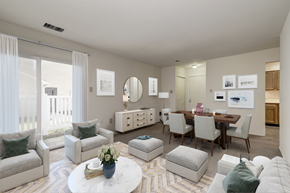 Waldorf apartment for rent - a staged living room and dining room with carpeted flooring and a large sliding glass door leading to a patio