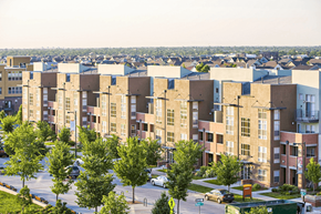 Denver apartment for rent - Apartment complex with trees and cars in front.