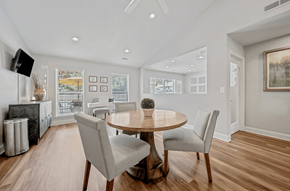Winston Salem apartment for rent - A modern dining room with a round table and chairs. at Brandemere Apartment Homes, Winston Salem, NC, 27106