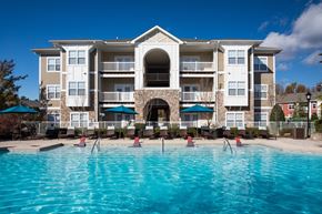 Charlotte apartment for rent - a large swimming pool in front of an apartment building