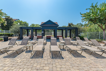 Resort-style swimming pool with jacuzzi & cabanas