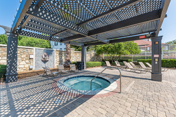 Resort-style swimming pool with jacuzzi & cabanas