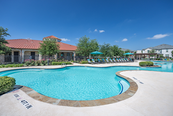 Resort-style swimming pool with sundeck