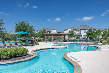 Resort-style swimming pool with sundeck