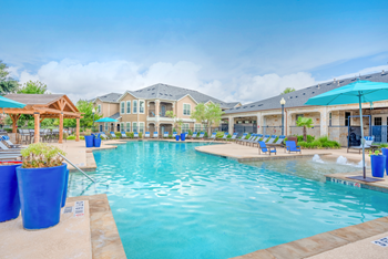 Resort-style swimming pool with sundeck