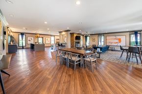 Seymour apartment for rent - A spacious clubhouse with a wooden table and chairs.