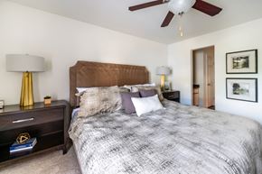 Seymour apartment for rent - A bedroom with a large bed and a ceiling fan.