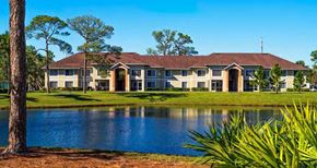 Greenacres apartment for rent - Waterfront View with Palm Trees and Building Exteriors