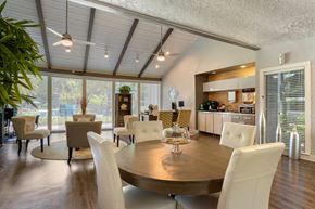 Houston apartment for rent - Clubhouse Lounge with Dining Table Chairs Coffee Tables and Leasing Desk with Chairs