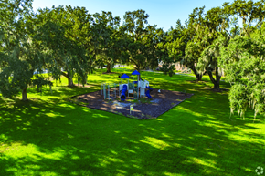 Kissimmee apartment for rent - A playground with a blue slide and a blue and white swing set.