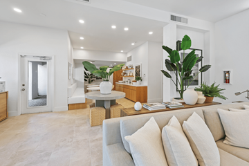 Coconut Creek apartment for rent - A living room with a white couch and a wooden coffee table.