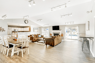 Columbia apartment for rent - A modern living room with a dining table and a fireplace.