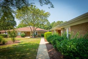 Waldorf apartment for rent - a walkway between two buildings at the whispering winds apartments in pearland, tx