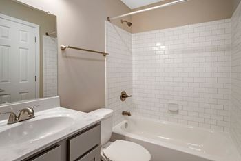 White subway tile in shower/tub surround