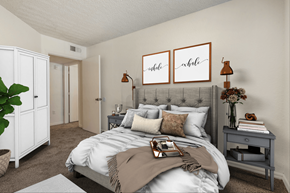 Naples apartment for rent - Virtually staged bedroom with carpet flooring, wall art, dresser, night stands, desk lamps, and carpet flooring