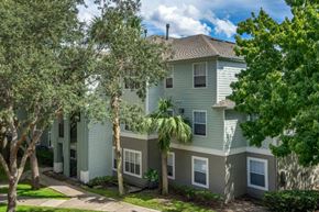 Orlando apartment for rent - Apartment building exterior surrounded by native landscaping