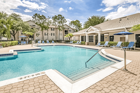 Sanford apartment for rent - Swimming pool with lounge seating and clubhouse in the background