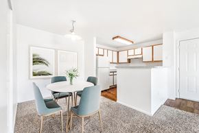 Brighton apartment for rent - Open dining area with kitchen and modern fixtures at Riverwalk Apartments, Colorado